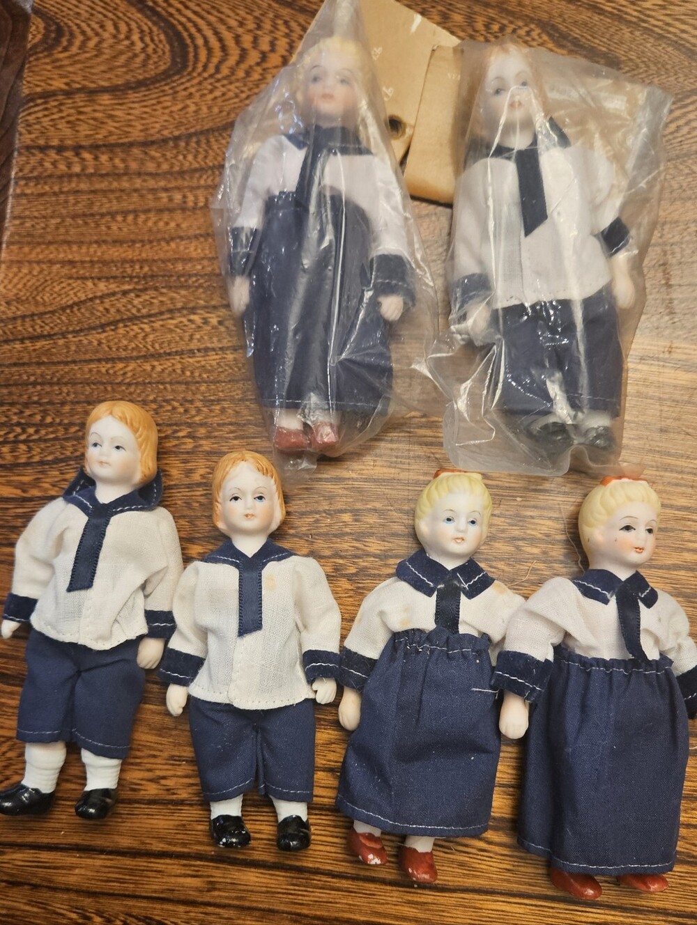 Six Vintage Hertwig Dolls. Two are still wrapped in plastic.